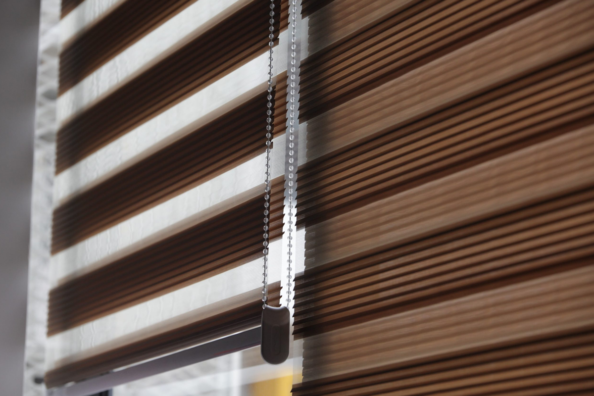 A close up of a window with blinds on it